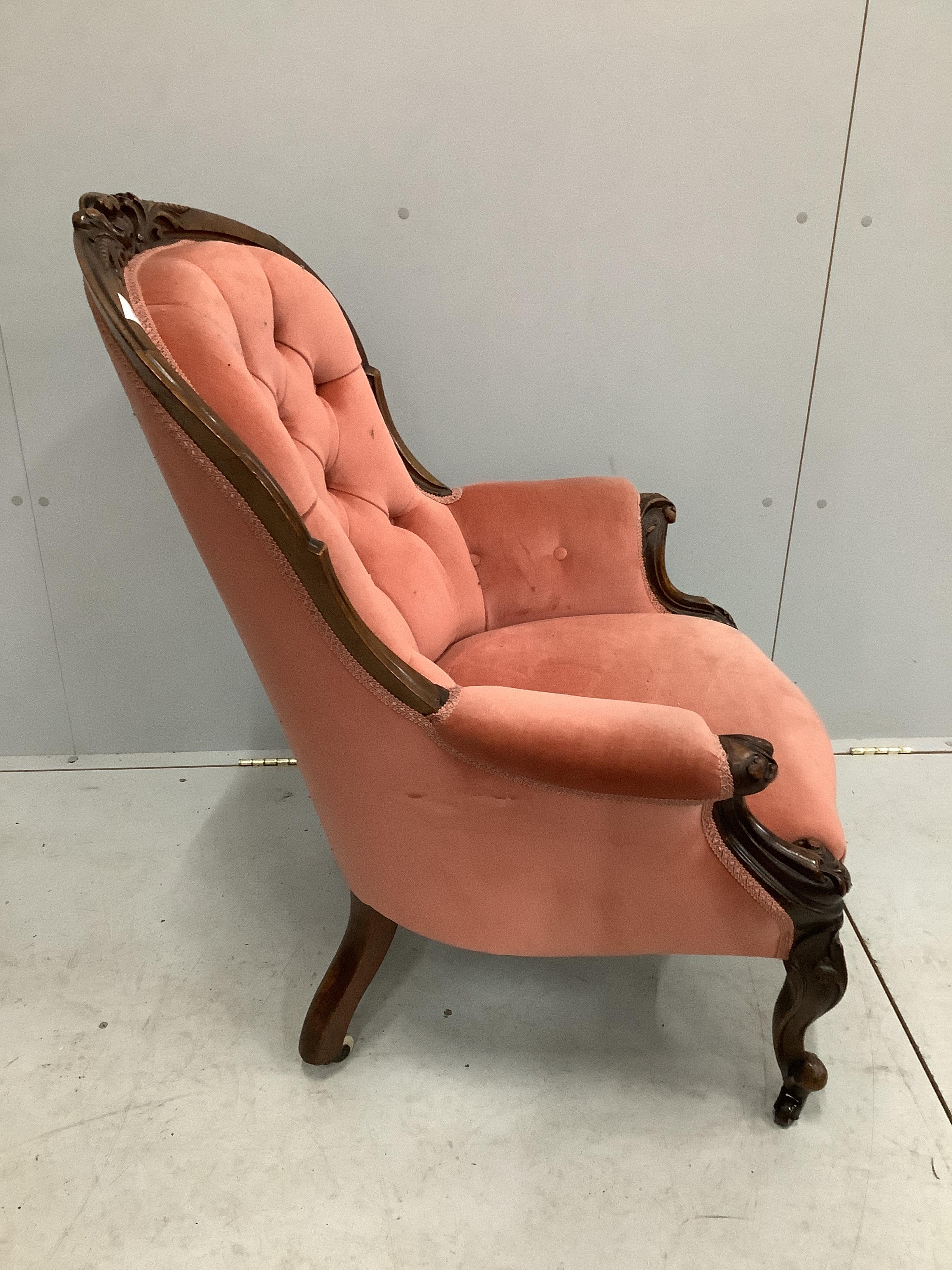 A Victorian walnut spoon back armchair, width 70cm, depth 72cm, height 98cm